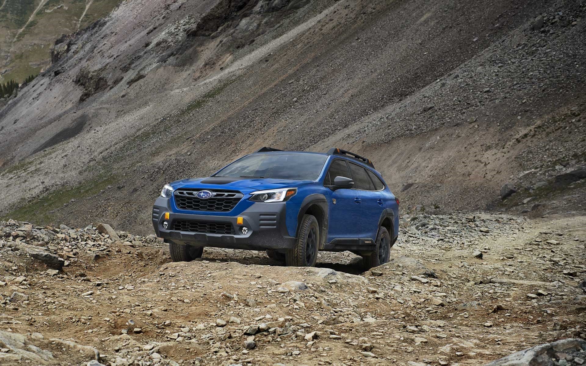 Subaru Outback Wilderness climbing rocky terrain.