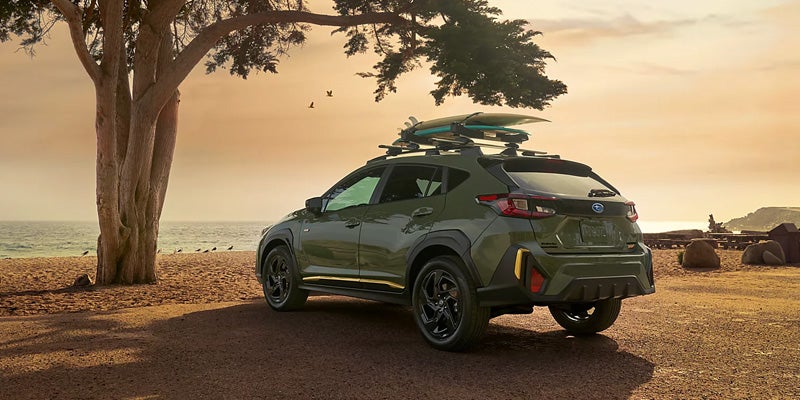 Green Subaru Crosstrek facing the sunset in Idaho Falls, ID